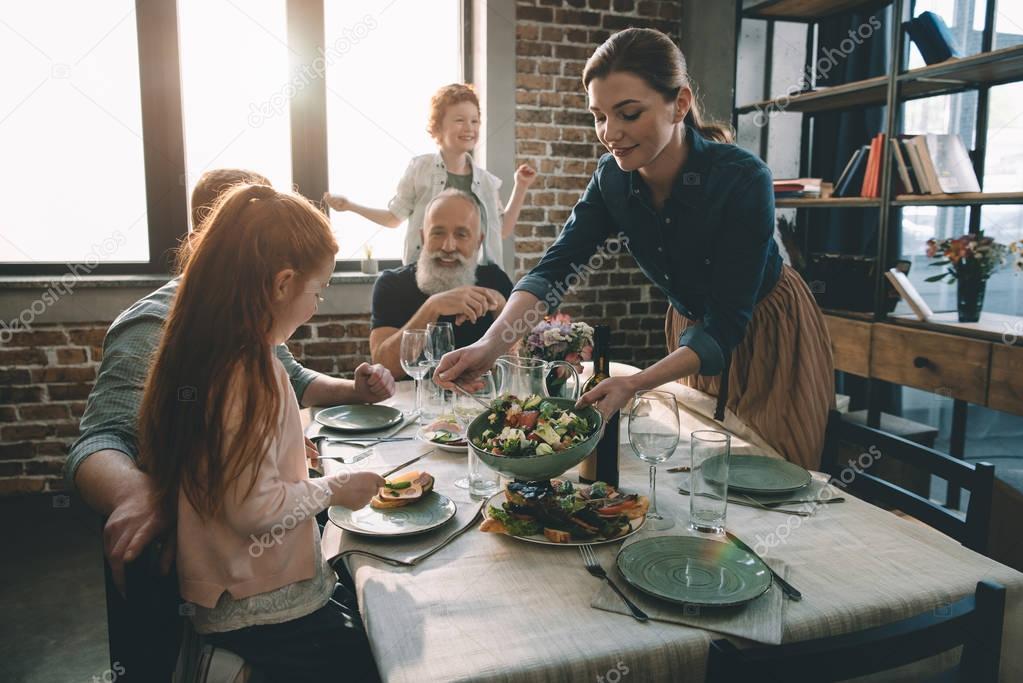 woman serving salad