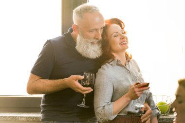 senior couple with glasses of wine