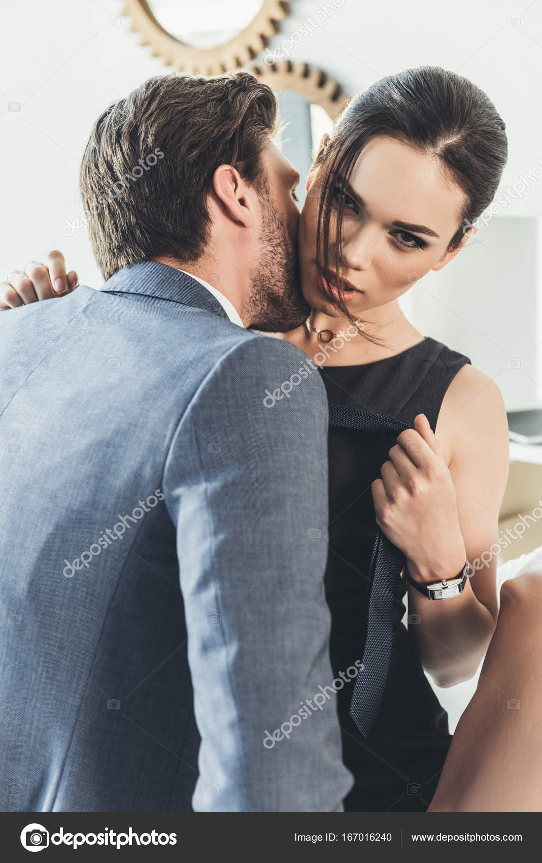 Young man kissing woman on neck — Stock Photo © DimaBaranow 167016240