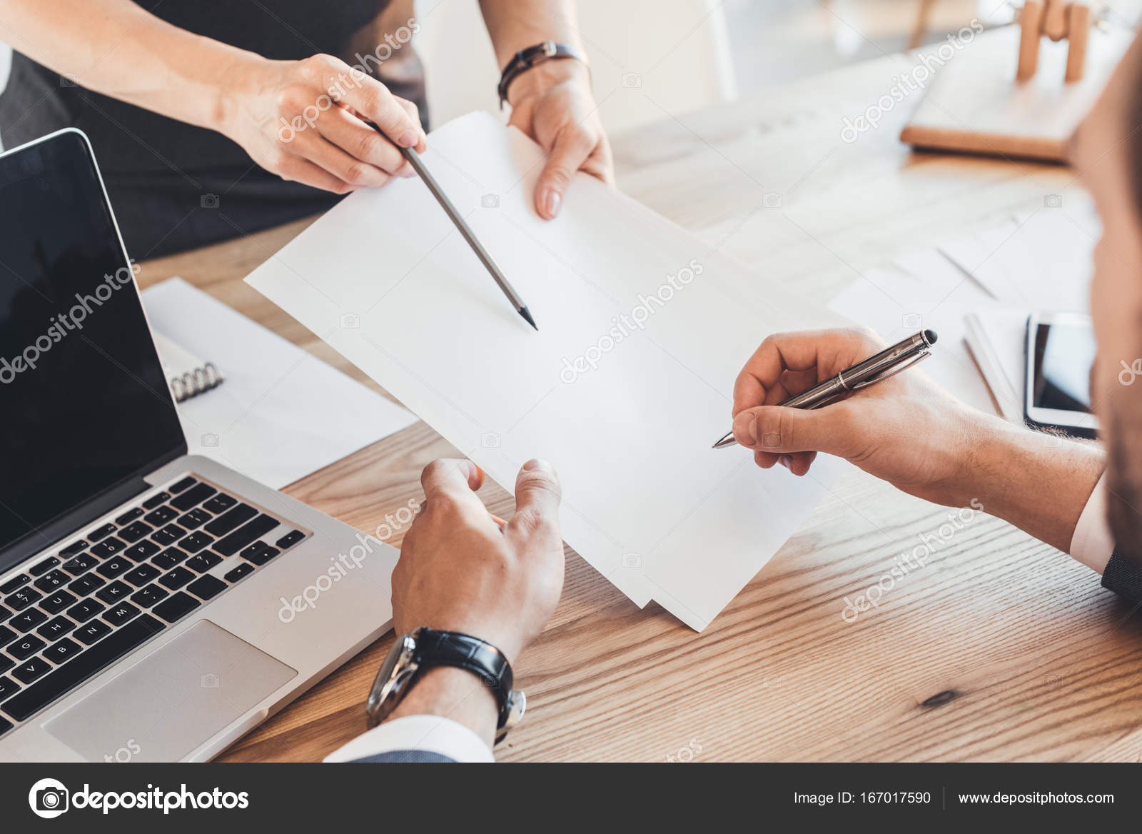 Man signing paperwork   Stock Photo  DimaBaranow 167017590