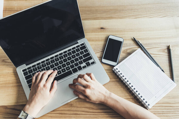 woman typing on laptop