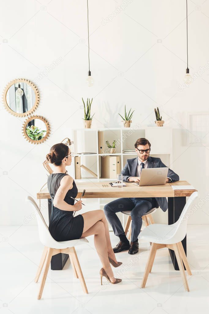 businessman with secretery discussing work