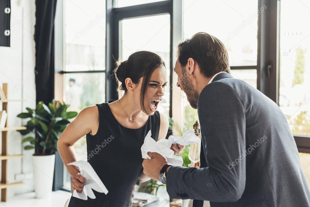 businesspeople screaming at each other