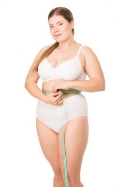 overweight woman measuring waist clipart