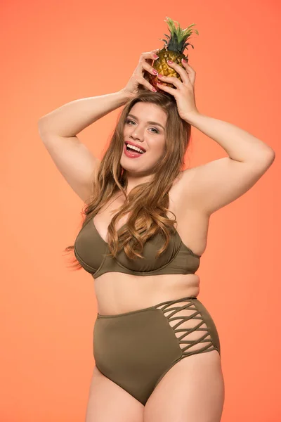 Overweight woman with pineapple — Stock Photo, Image