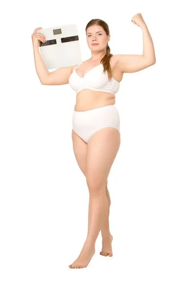 Overweight woman posing with scales — Stock Photo, Image