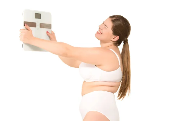 Overweight woman with scales — Stock Photo, Image
