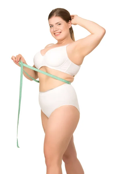 Übergewichtige Frau misst Taille — Stockfoto