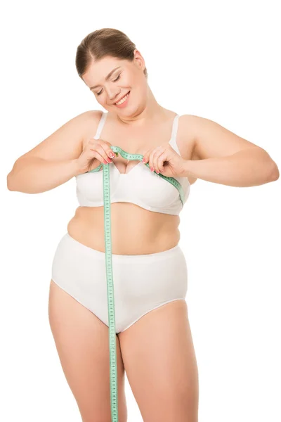 Übergewichtige Frau misst Brust — Stockfoto
