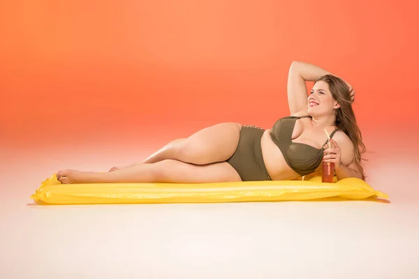 Woman relaxing on inflatable mattress Stock Image