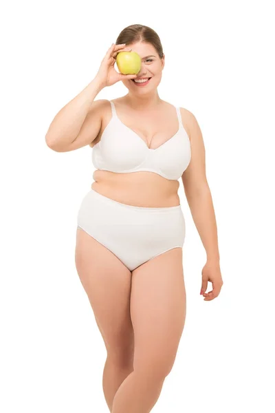 Mujer gorda con manzana Fotos De Stock