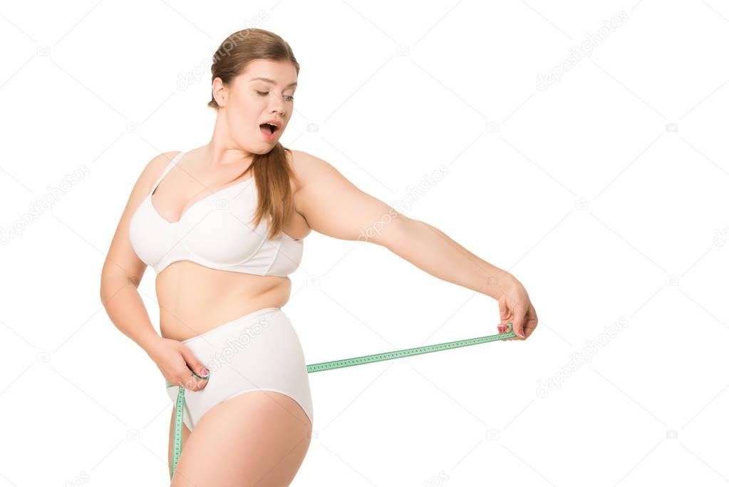shocked woman measuring butt