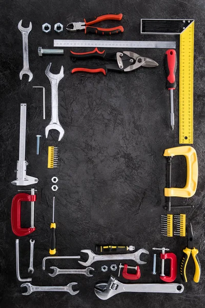 Top view of set of various work tools on black — Stock Photo