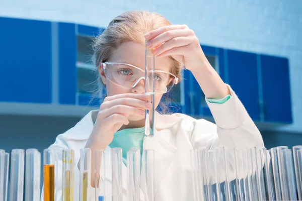 Girl in goggles with tube — Stock Photo