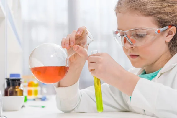 Girl in goggles with flasks — Stock Photo