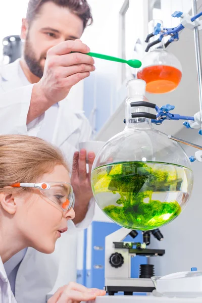 Teacher and student making experiment — Stock Photo