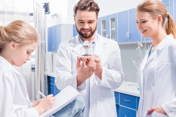 Teachers and student in lab — Stock Photo