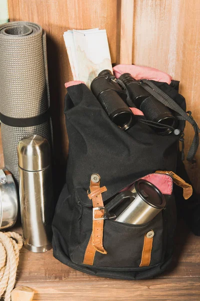 Different trekking equipment on bench — Stock Photo