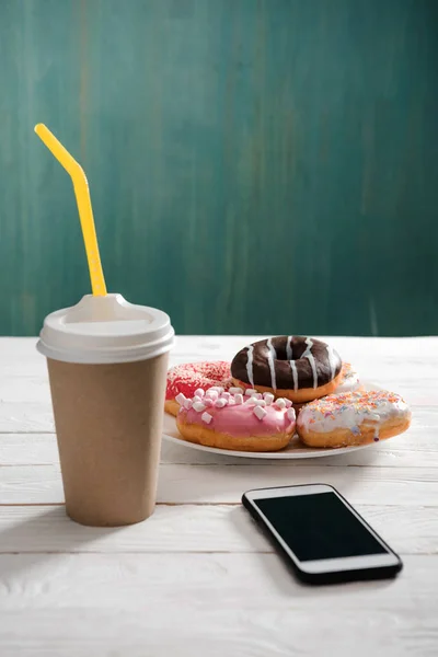 Breakfast with coffee and donuts — Stock Photo