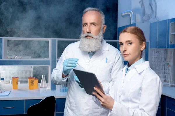 Laboratory technicians in lab coats — Stock Photo
