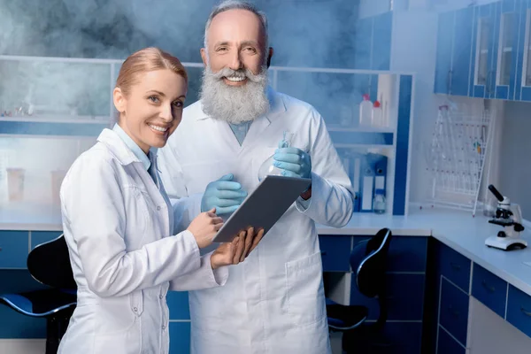 Colleagues using digital tablet at laboratory — Stock Photo