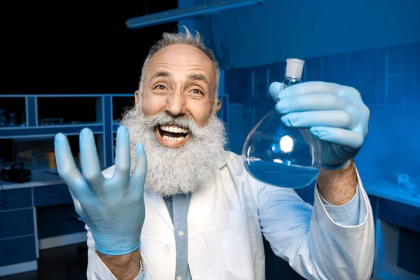 Grey haired scientist celebrating success — Stock Photo