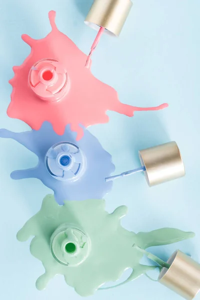 Spilled colorful nail polishes — Stock Photo