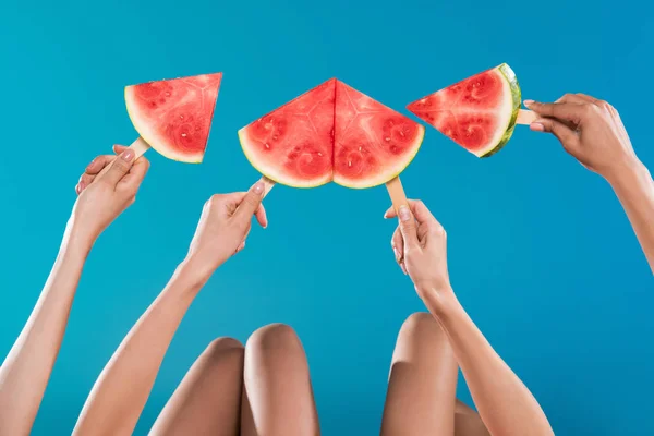 Young women holding watermelon pieces — Stock Photo
