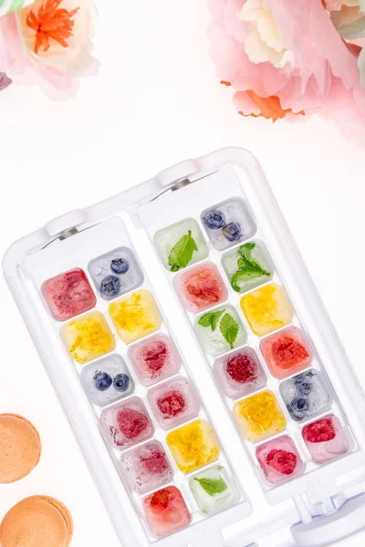 Berries in ice cubes — Stock Photo