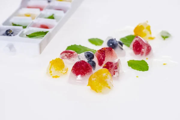 Berries in ice cubes — Stock Photo