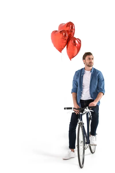 Человек с велосипедом и воздушными шарами — стоковое фото