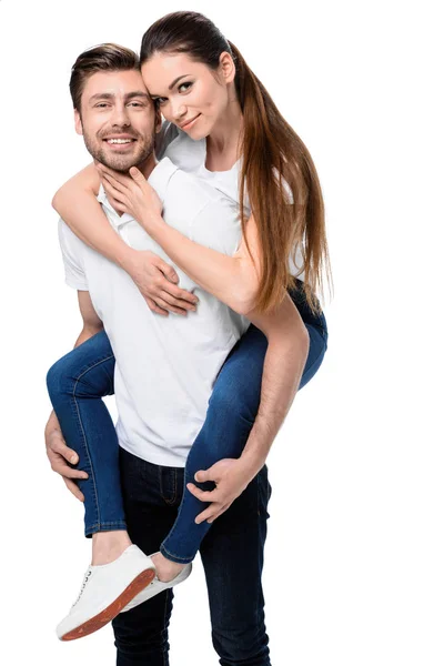 Feliz pareja piggybacking - foto de stock