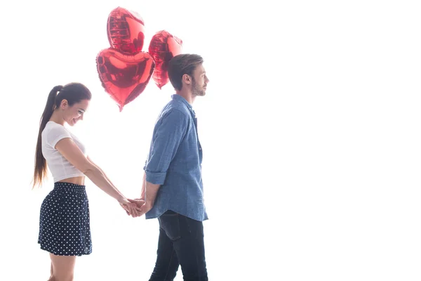 Couple avec ballons en forme de coeur — Photo de stock