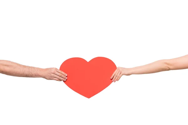 Couple holding red heart — Stock Photo
