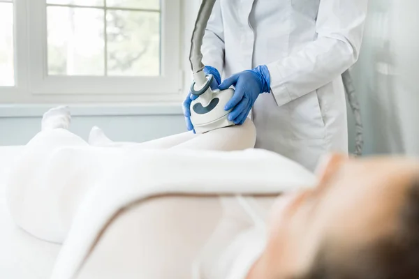 Woman having procedure of lipomassage — Stock Photo