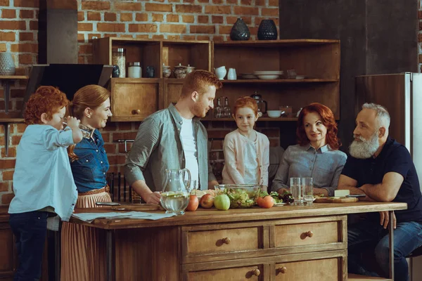 Family cooking dinner together — Stock Photo