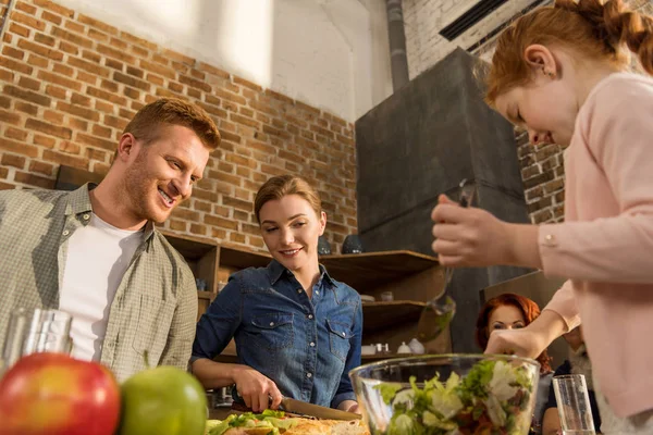 Wife and husband cooking together — Stock Photo