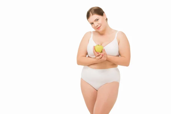 Mujer con sobrepeso con manzana - foto de stock