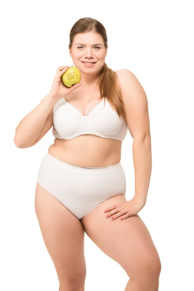 Fat smiling woman with apple — Stock Photo