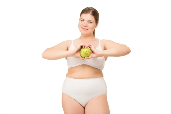 Overweight woman in underwear holding apple — Stock Photo