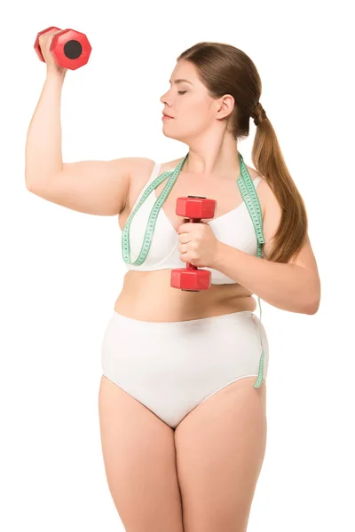Mujer gorda con cinta métrica y pesas — Stock Photo