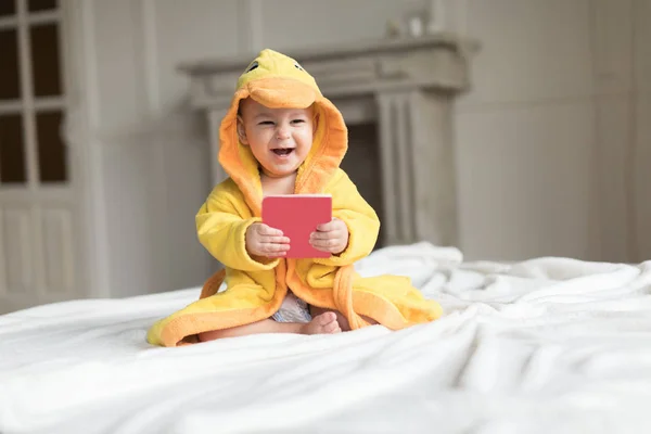 Baby boy in yellow robe — Stock Photo, Image