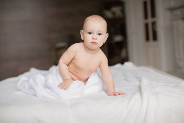 baby boy with white towel clipart