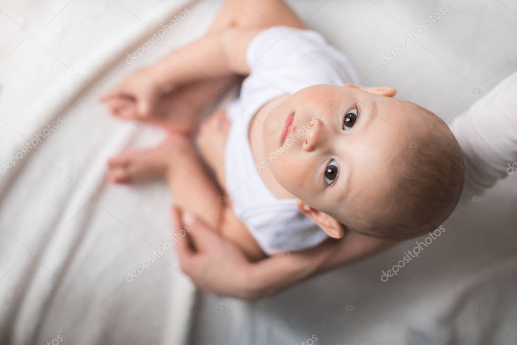 Cute baby boy on bed