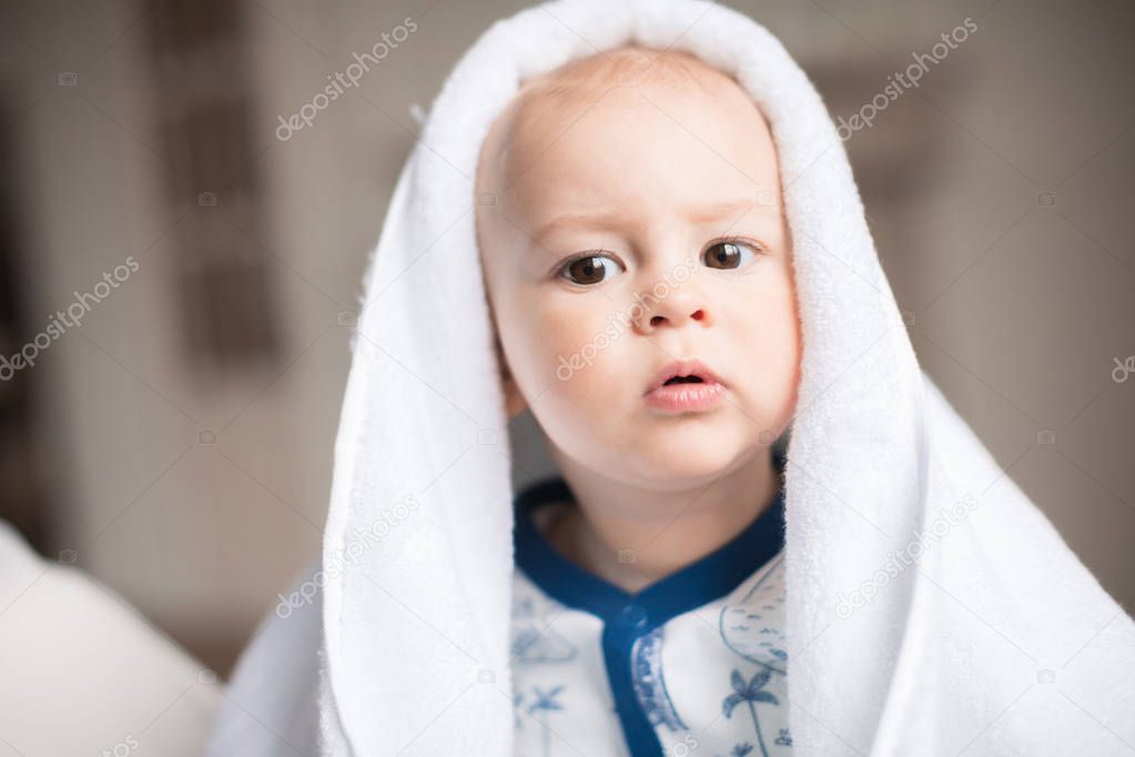 baby boy with white towel