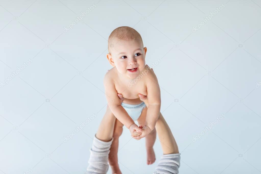 mother holding baby   