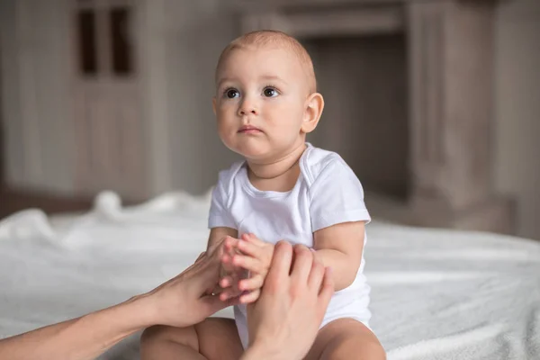 Cute baby boy on bed — Stock Photo