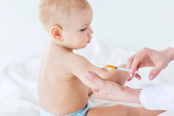 Baby boy at vaccination — Stock Photo