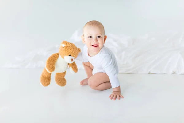 Baby boy with teddy bear — Stock Photo