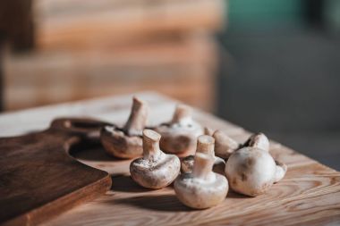 mushrooms laying on wooden table clipart